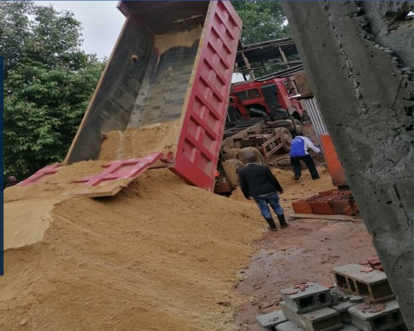 Construction materials delivery - Gremasu truck unloading sand at construction site